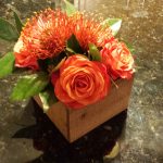 Orange rose and flower arrangement