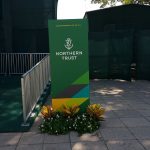 Plants in front of Northern Trust sign
